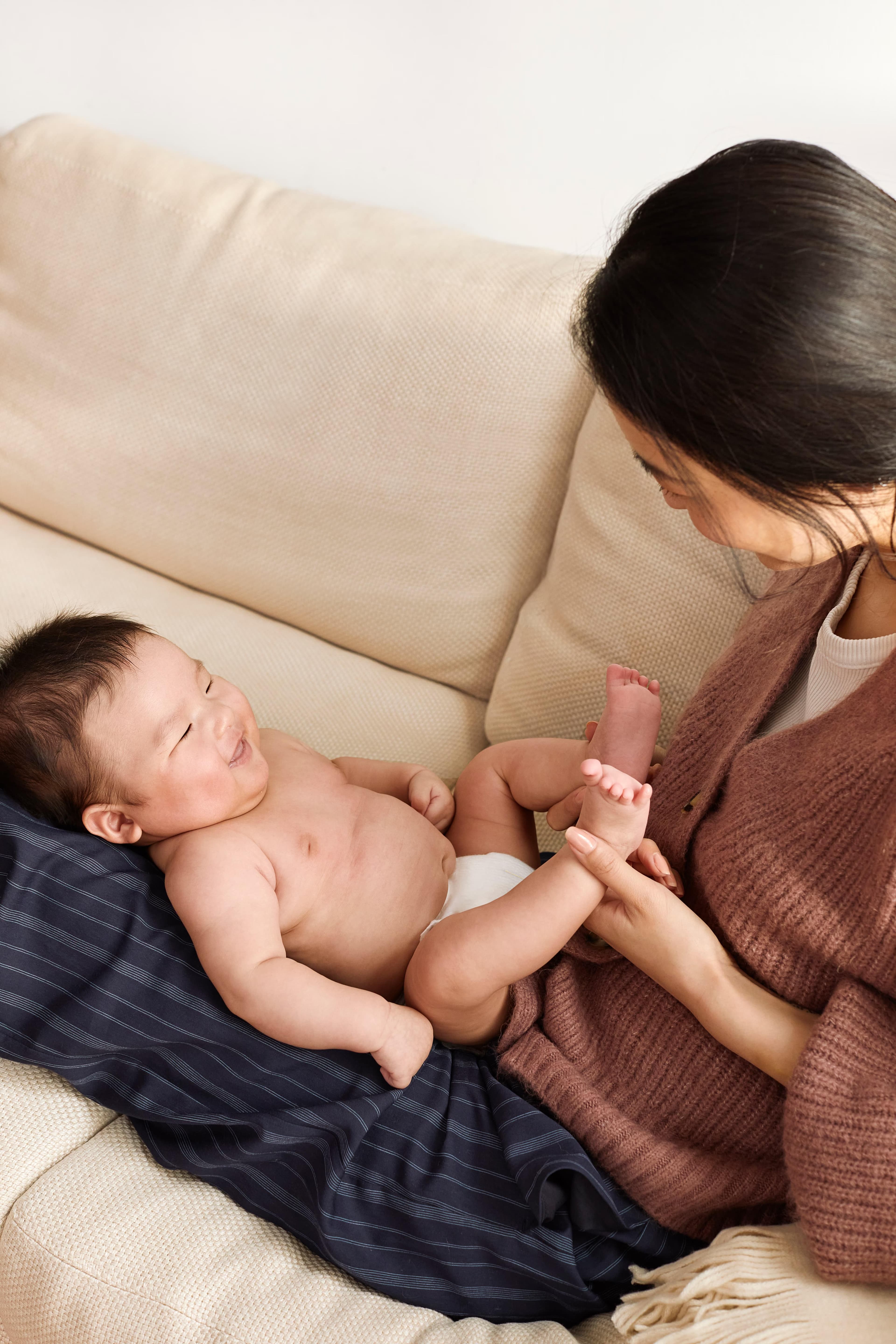 A mother playing with her baby